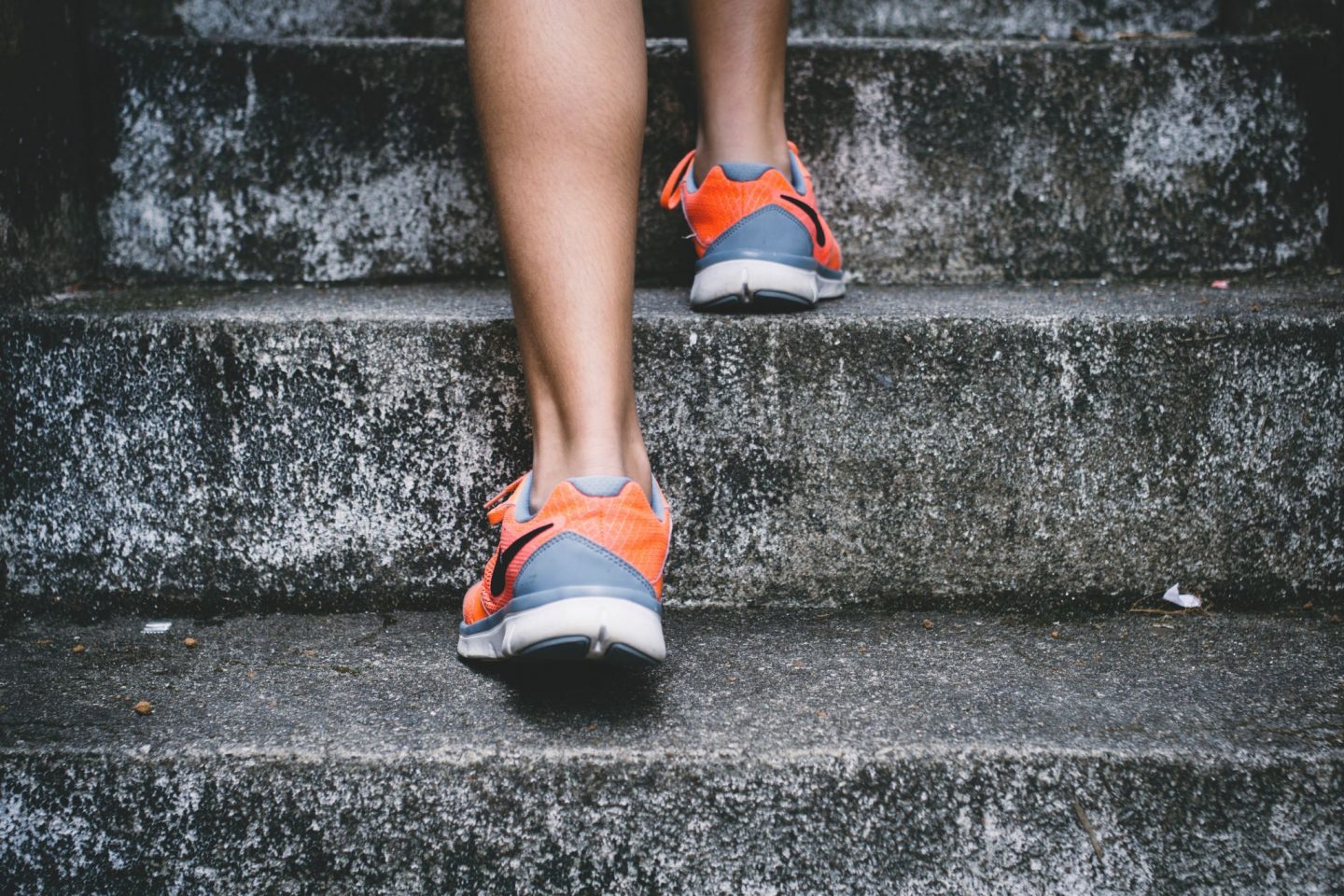 Runner running up steps