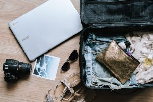 Holiday packing, suitcase and technology