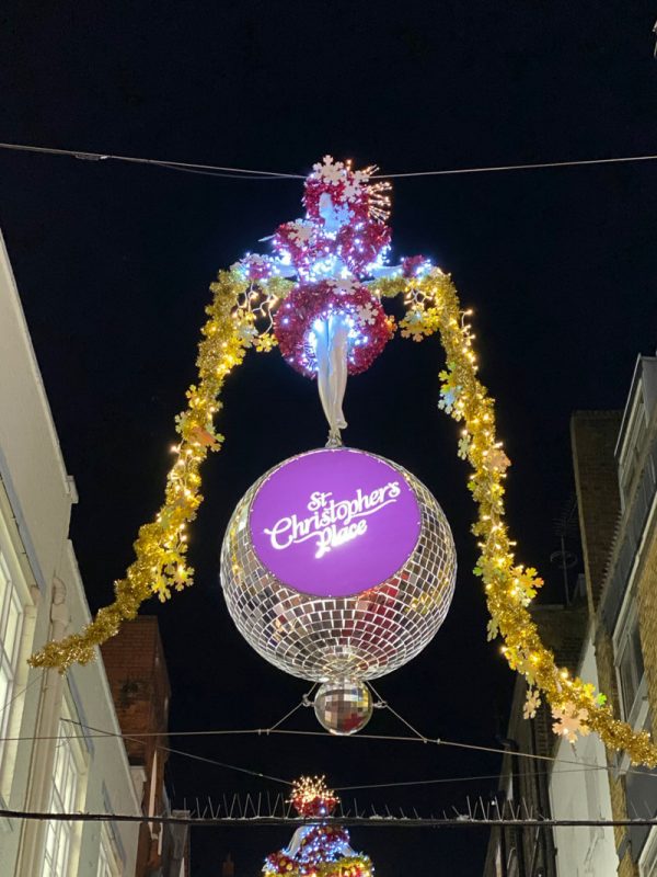 Dancing girl standing on top of disco ball