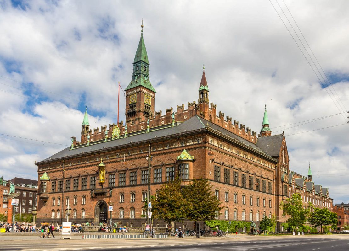 Red bricked building with towers.
