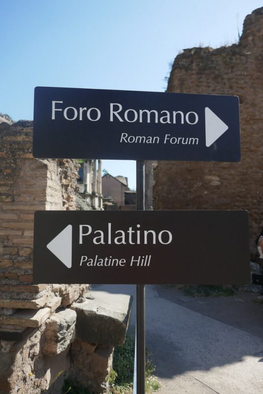 Sign pointing one way to The Forum and the other way to Palatine Hill