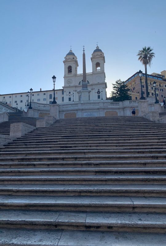 Looking up white steps (Spanish Steps) towards the church at the top
