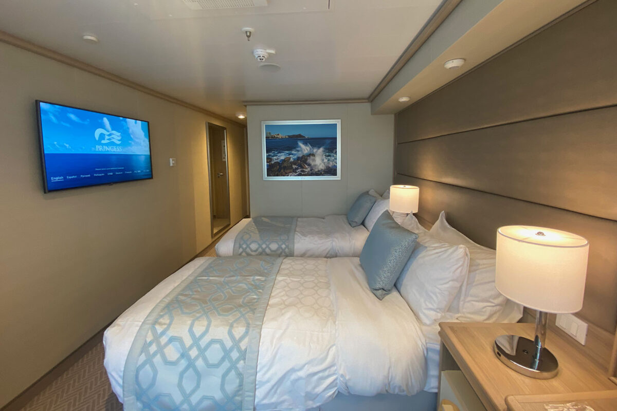image of cabin on Enchanted Princess set up with a twin bed configuartion
