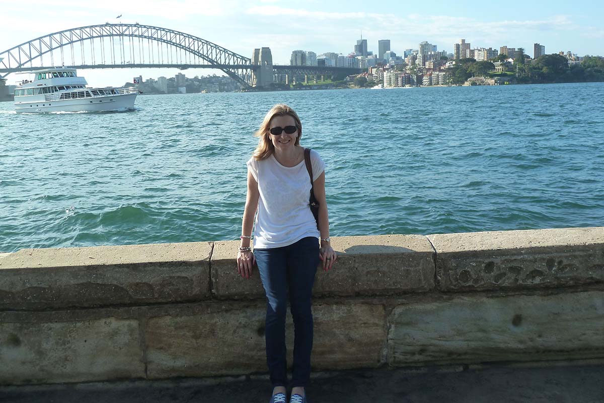 Emmaonline sitting in front of the Sydney Harbour Bridge