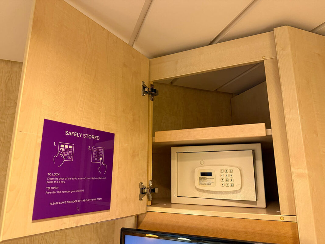 Open wardrobe safe in an inside cabin on Ambassador Ambition.